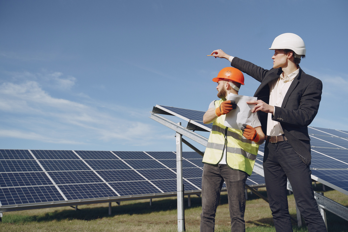 Electricians Inspecting the Solar Panels